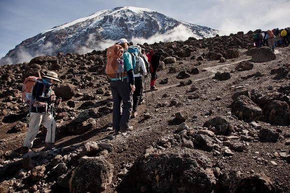Scenic view of climbers hiking along the high-altitude Umbwe Route on Mount Kilimanjaro