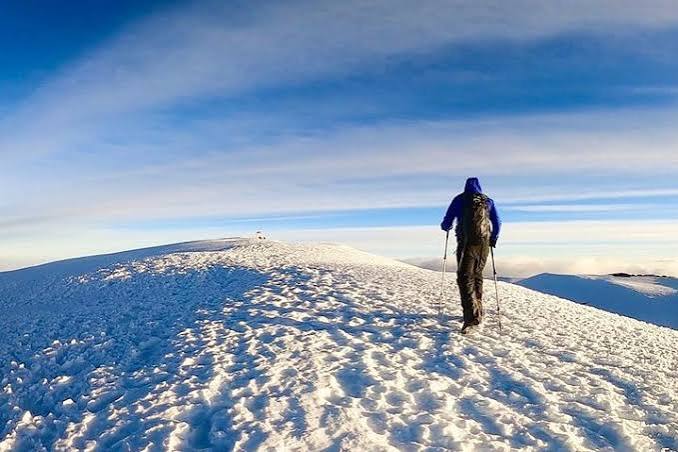 Hikers ascending Mount Kilimanjaro along the steep and scenic Umbwe Route