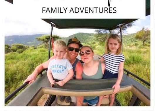 Tanzania family tour group watching wildlife herds grazing on a private safari