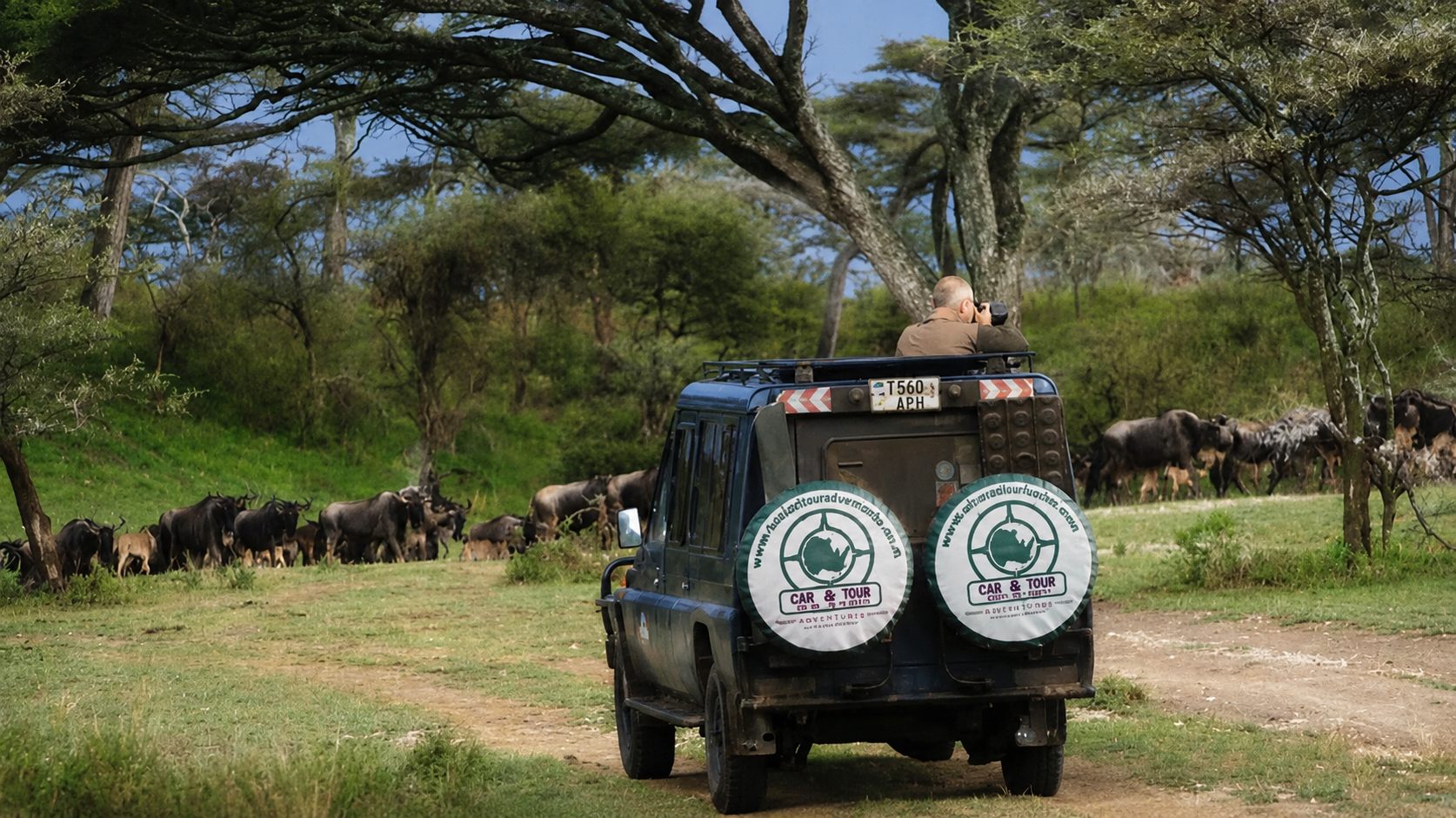 Safari 4x4 vehicle entering Serengeti National Park from Mwanza for a game drive